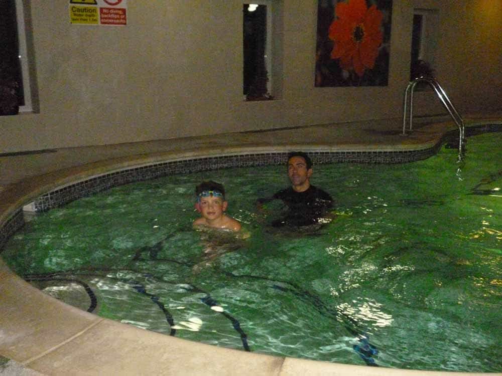 Andy Gamble giving swimming lessons in water